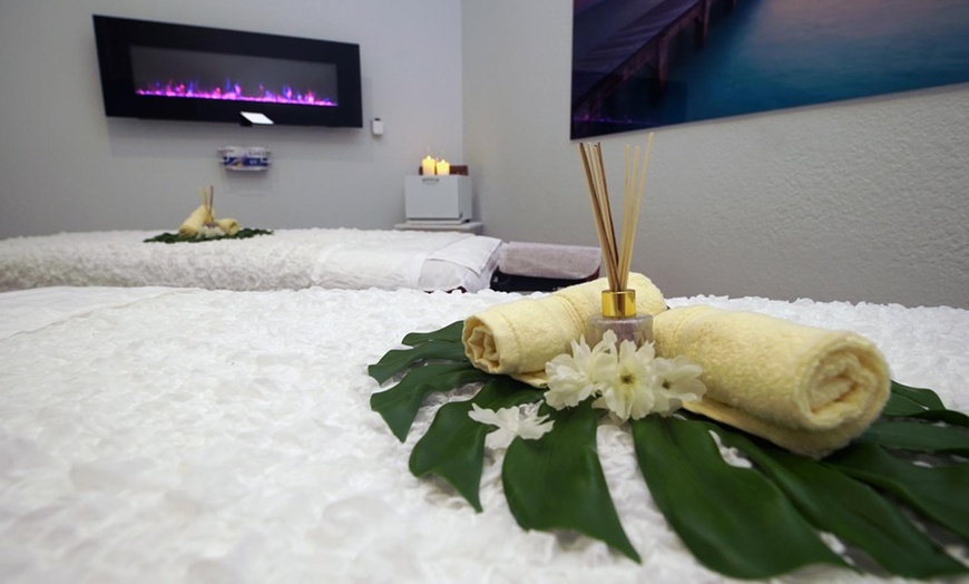 Image 1: 60-Minute Hot Stone Massage with Aromatherapy for One or a Couple