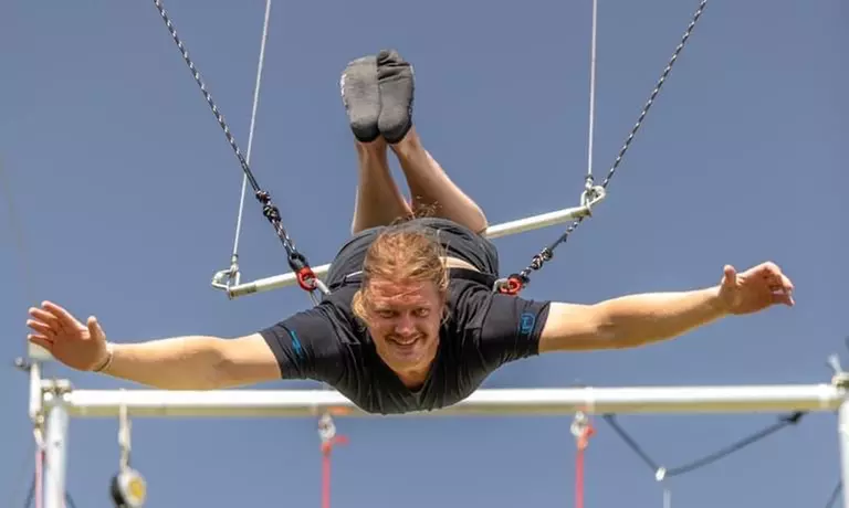 Join Texas Circus and Aerial for Flying Trapeze Classes or Private Parties with up to 25% off, offering a thrilling experience - Second Medium