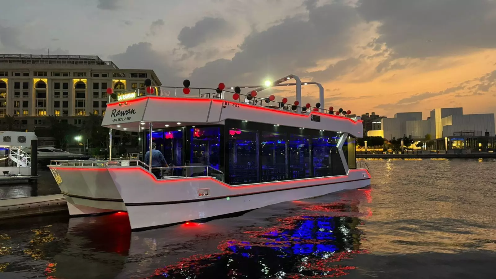 Dubai Canal dhow dinner cruise with soft beverages and live shows