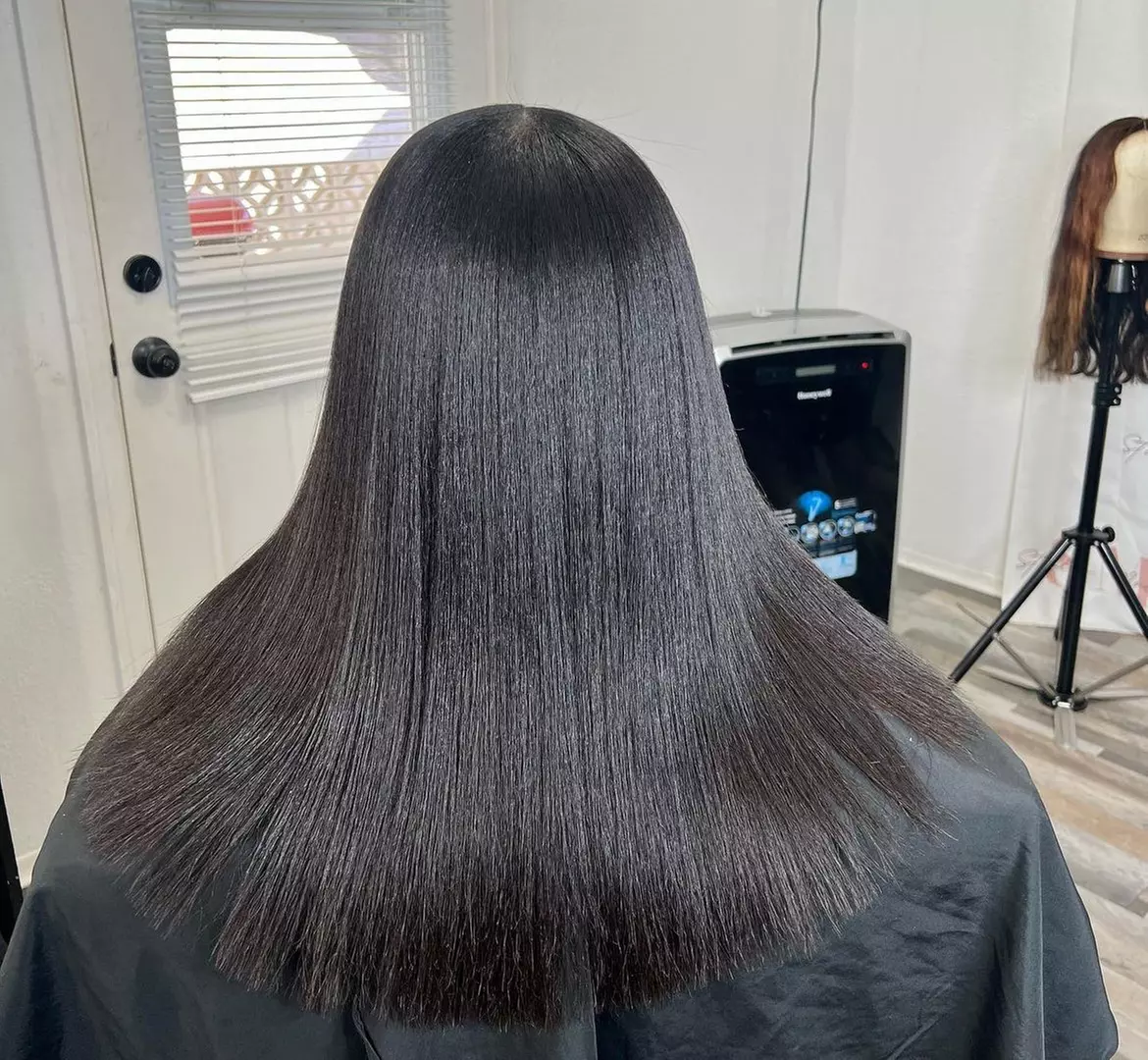 Voucher Towards Silk press w/ 30 Min Massage, Shampoo, Deep conditioning Mask and Trim - Primary Image