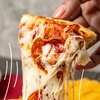 Image 1: Up to 40% Off on Pizza at Singas Famous Pizza