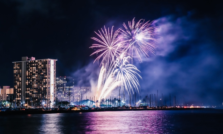 Image 1: Waikiki Snorkel Company offers 1.5 hour cruises for up to four with fireworks and up to 10% off