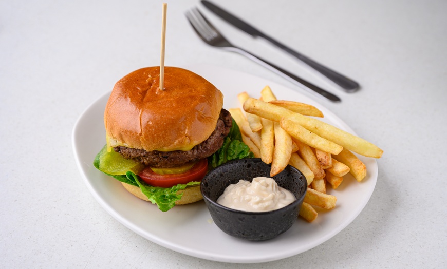 Image 1: Satisfying Burger with Chips for One with Optional Drink for Two