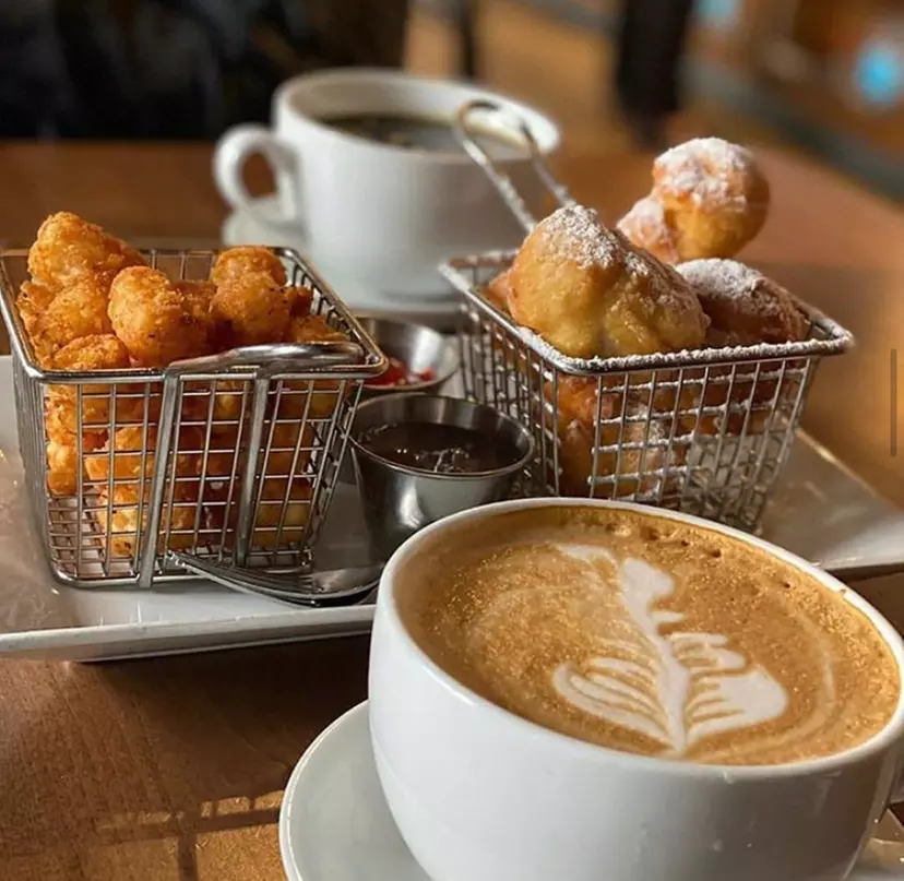 Enjoy a sandwich, coffee, and beignets at The Nest Cafe