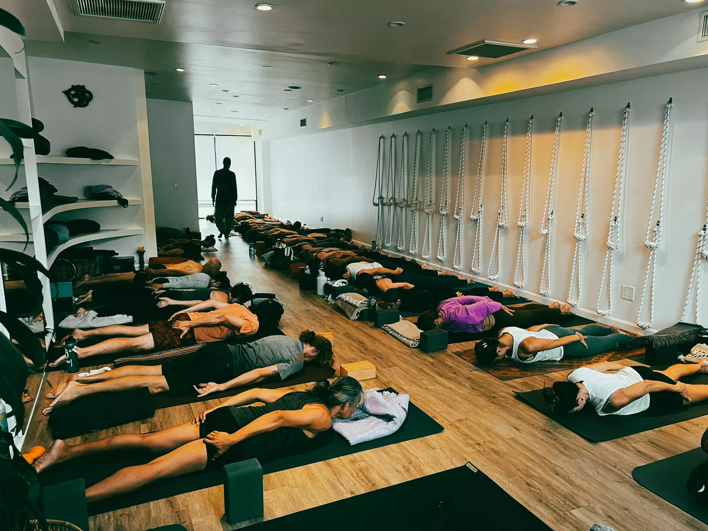 Experience The Yoga Center's serene setting with unlimited yoga classes, offering a peaceful retreat and up to 48% off - Primary Image