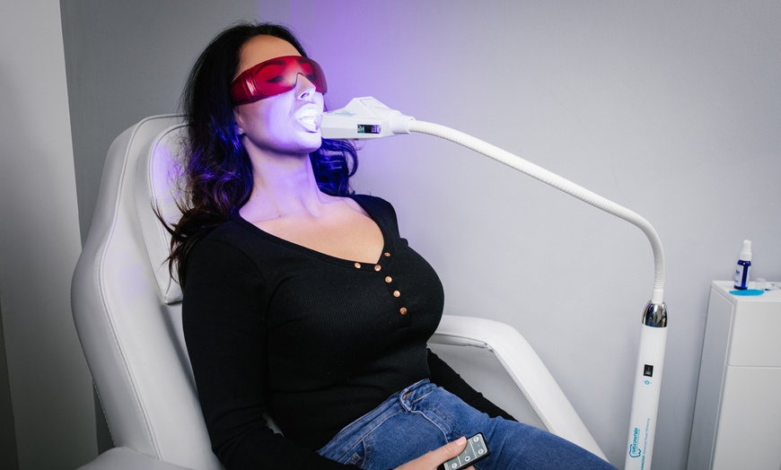 Image 1: Up to 54% Off on Teeth Whitening - In-Office - Branded (Zoom, Brite Smile) at FaceUp Aesthetics