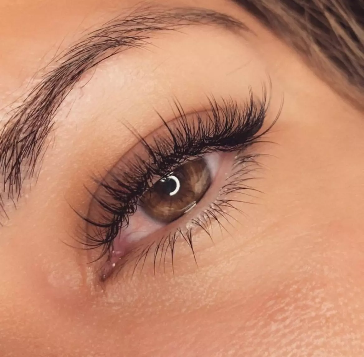 Enhance your eyes at Lebanon Merle Norman Boutique & Spa with options like Classic or Hybrid Eyelash Extensions up to 32% off - Second Medium