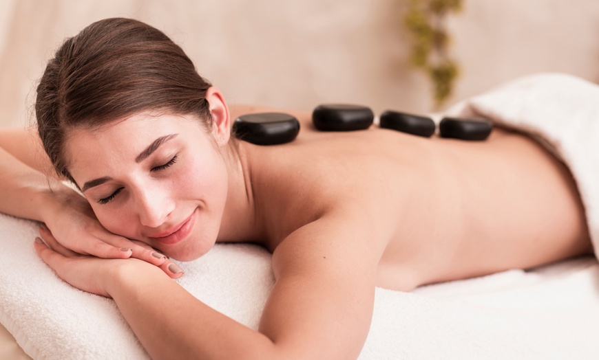 Image 1: One 60-Minute Hot Stone or Full Body Massage (Swedish or Aromatherapy)