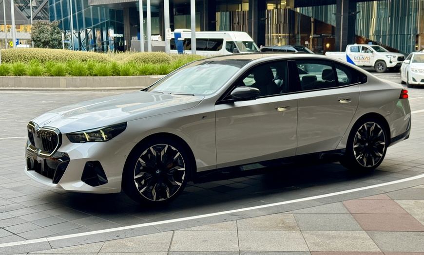 Image 1: Experience Luxury Transfers with Chauffeur/Meet & Greet in 2025 BMW i5