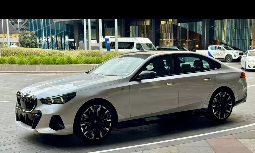 Image 1: Experience Luxury Transfers with Chauffeur/Meet & Greet in 2025 BMW i5