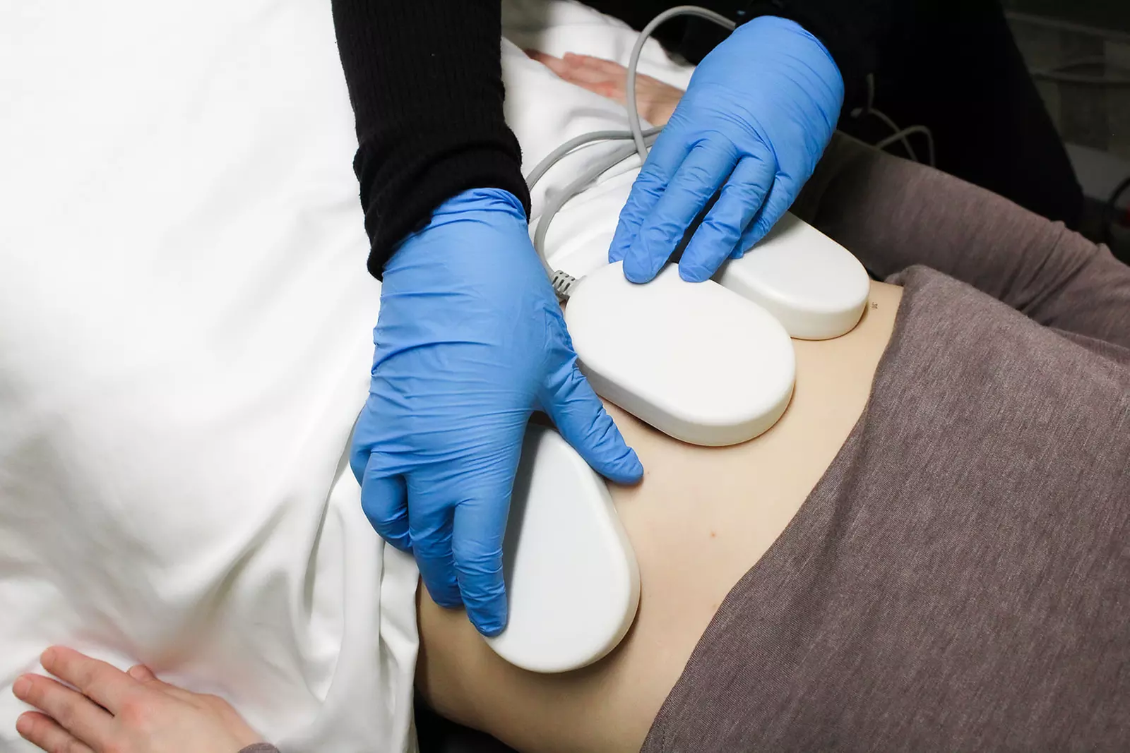 Experience Holistic Health & Beauty's non-invasive LipoSculpt with options for up to 82% off to target stubborn fat - Primary Image