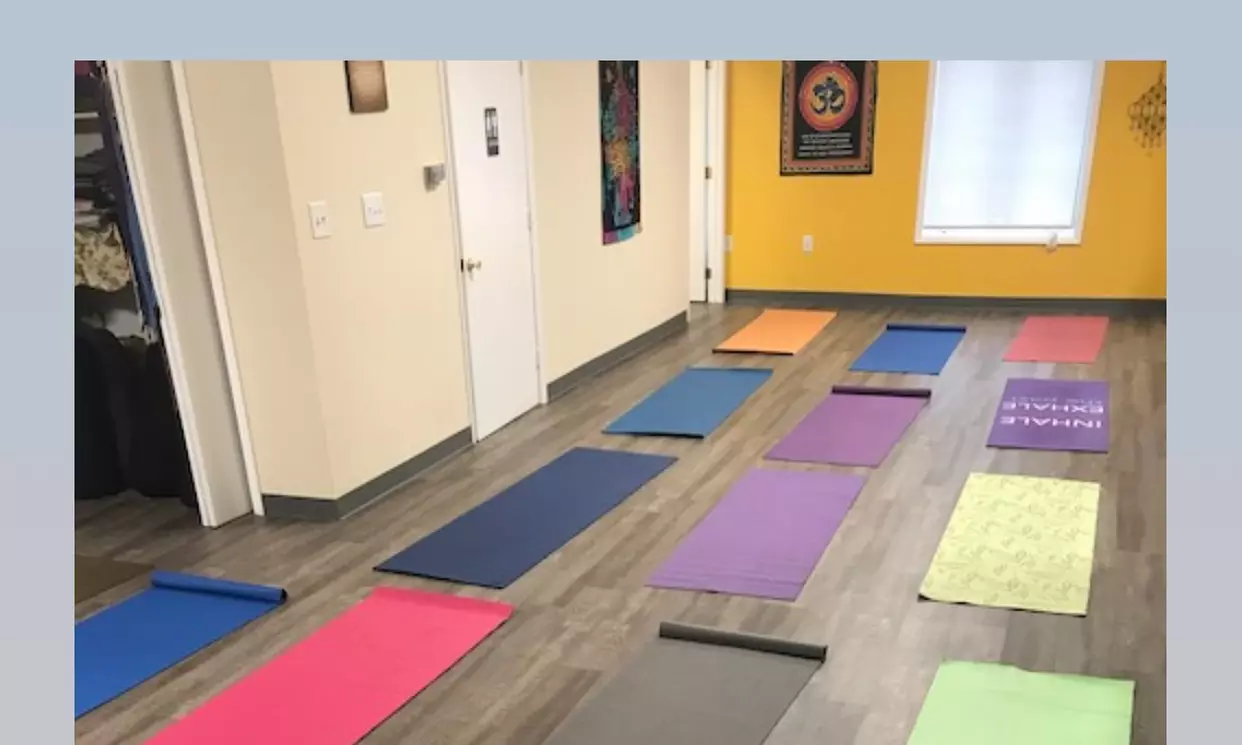 Join Yoga Classes for 30 Days or Drop-In with a Friend at Radio Yogi Health and Fitness (Up to 58% Off) - Primary Image