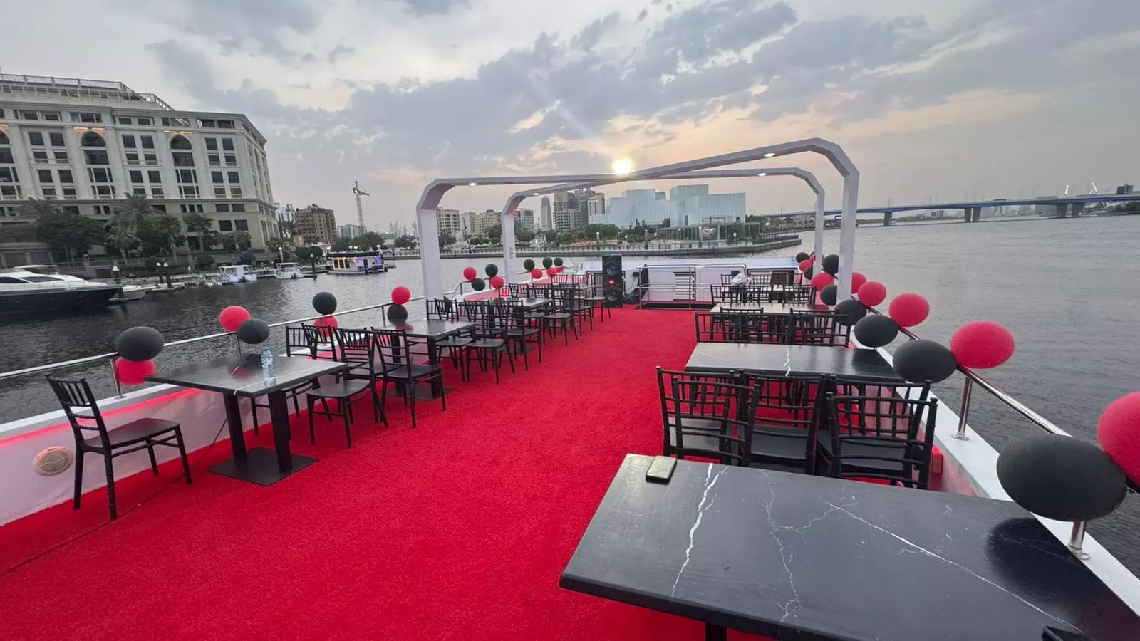 Dubai Canal dhow dinner cruise with soft beverages and live shows