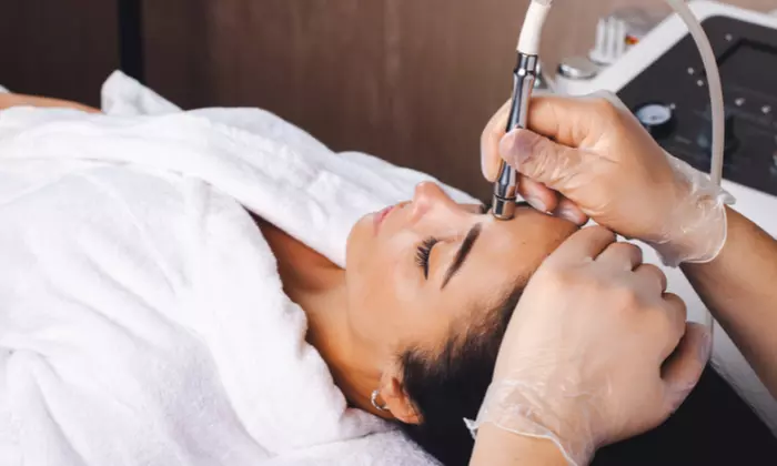 Revitalize Your Complexion With an Ultrasonic Facial Using Extractions, Microdermabrasion, LED or Under Eye Treatment - Second Medium