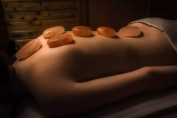 (Up to 31% Off) on 60 or 90 - Minute Full Body Massage with Himalayan Stones at Happy Feet Spa - Primary Image