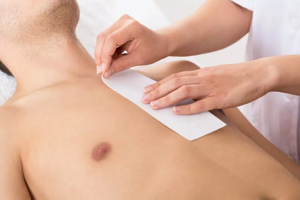 Experience smooth skin with BeBe Day Spa's men's waxing for up to three areas, offering a polished look and up to 40% off - Primary Image