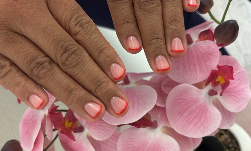 Image 4: Experience Awaits: French Gel Manicure and Deluxe Gel Pedicure Combo