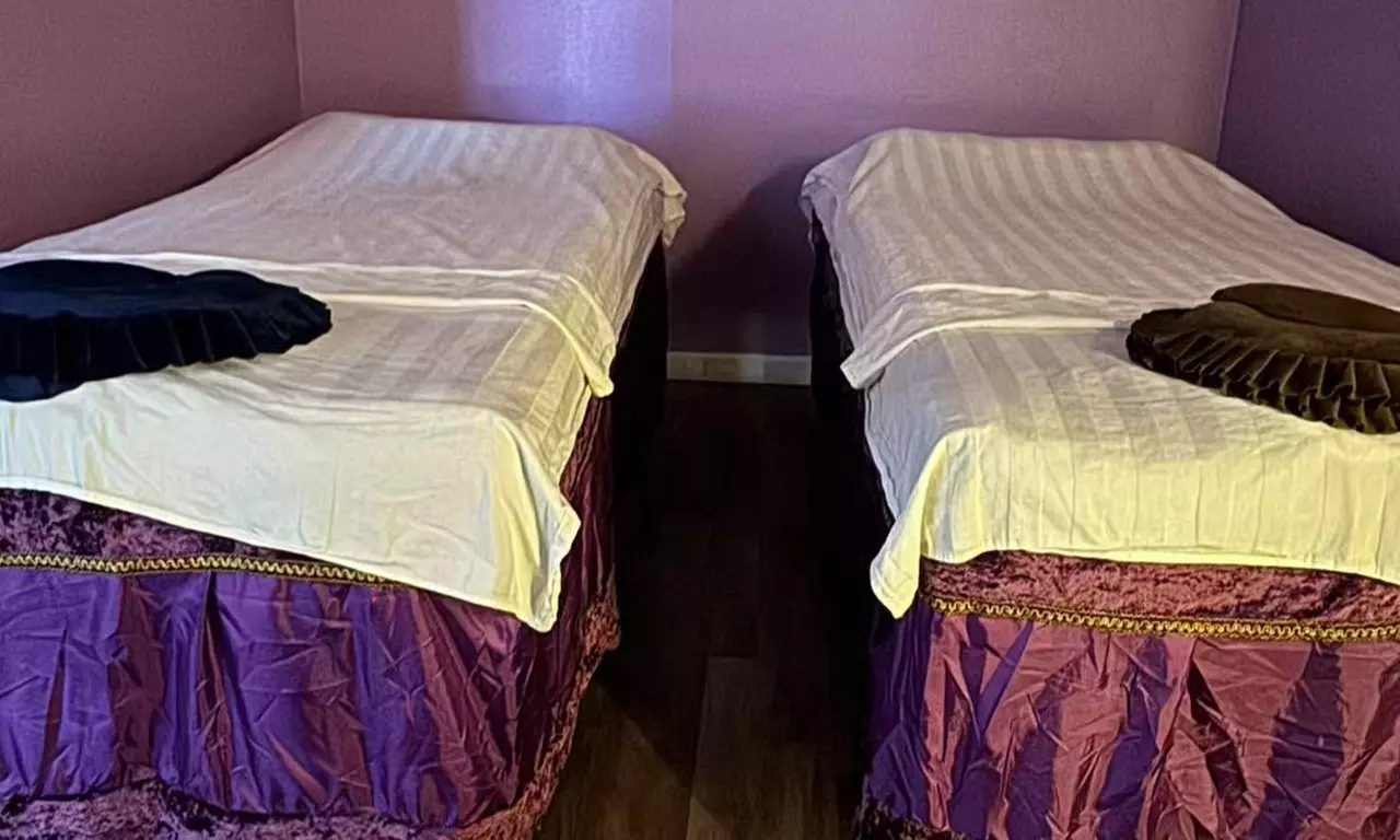 Relax with 60-Minute Deluxe Body or Custom Combo Massage with Hot Stone & Optional Massage Oil (Up to 61% Off)