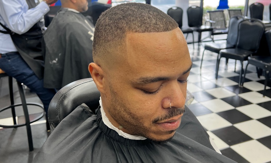 Image 2: Refined haircuts and traditional grooming services