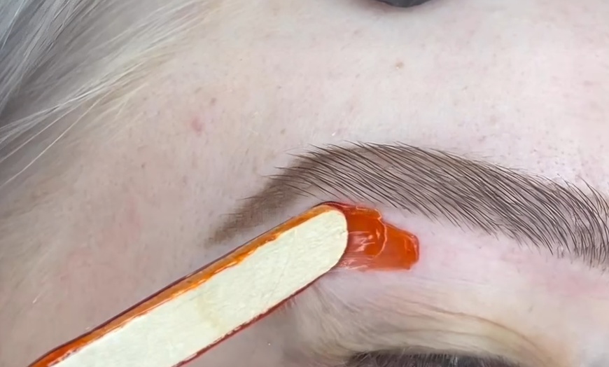 Image 5: Smooth Skin with One or Three Brazilian, or Eyebrow Waxing Sessions