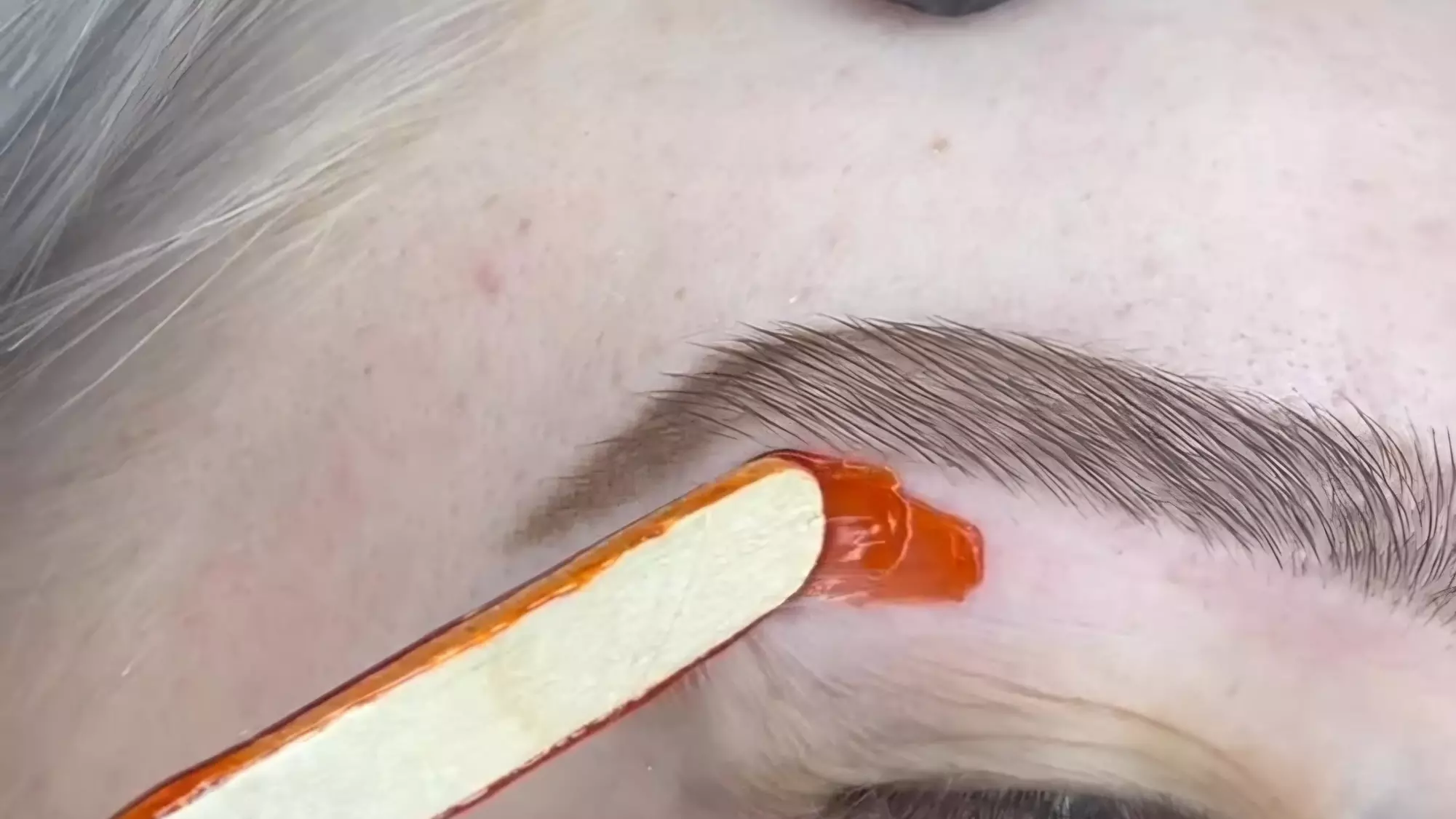 Smooth Skin with One or Three Brazilian, or Eyebrow Waxing Sessions