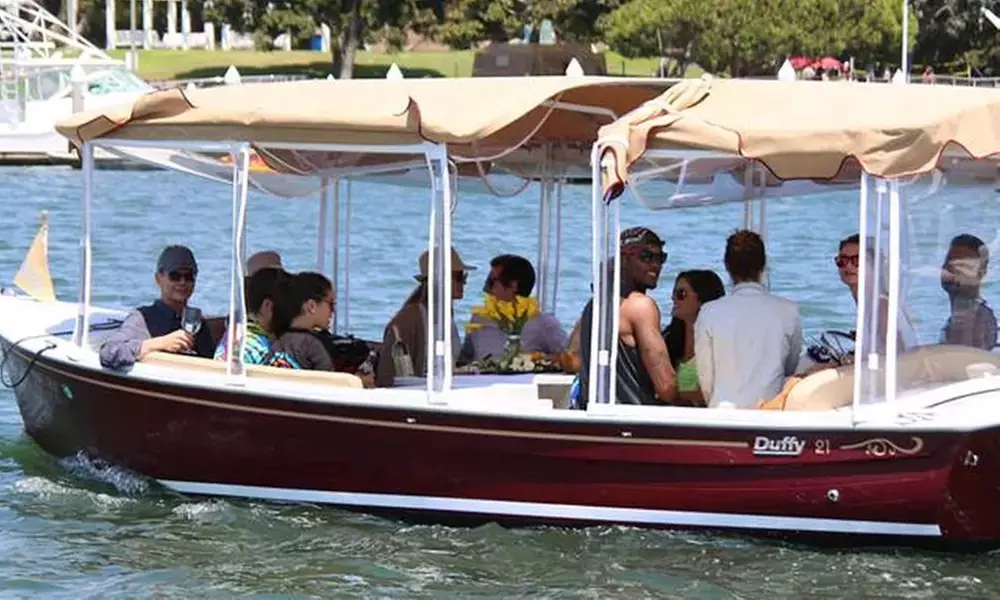 Experience Serene Newport Harbor Sunset Cruises Aboard an Eco-Friendly Electric Duffy Boat Rental