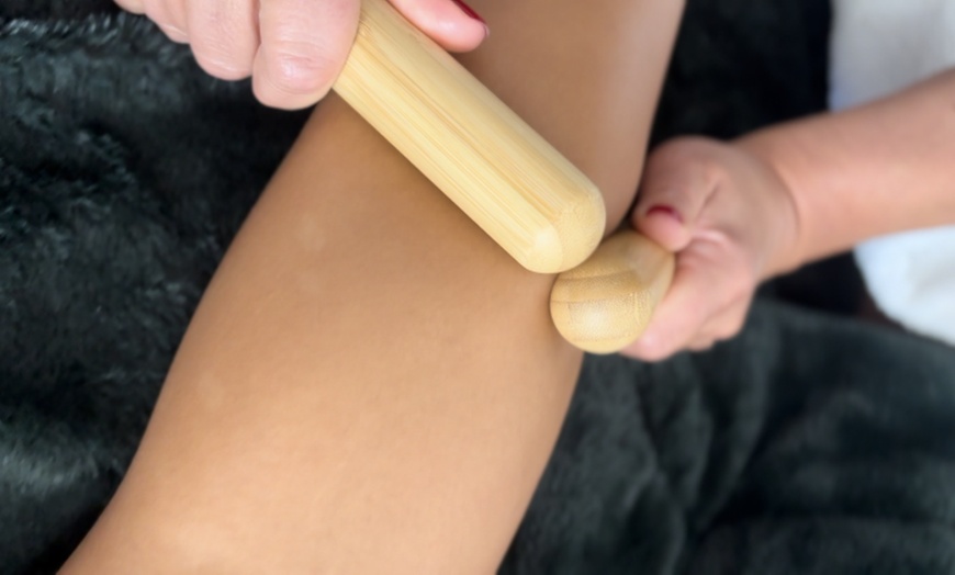 Image 1: Warm Bamboo Massage for Deep Relaxation