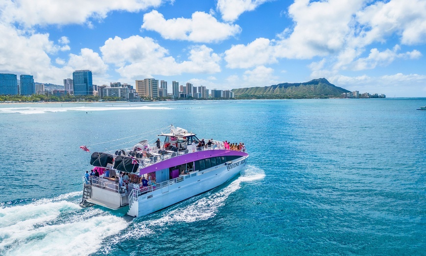 Image 2: Waikiki Snorkel Company offers 1.5 hour cruises for up to four with fireworks and up to 10% off