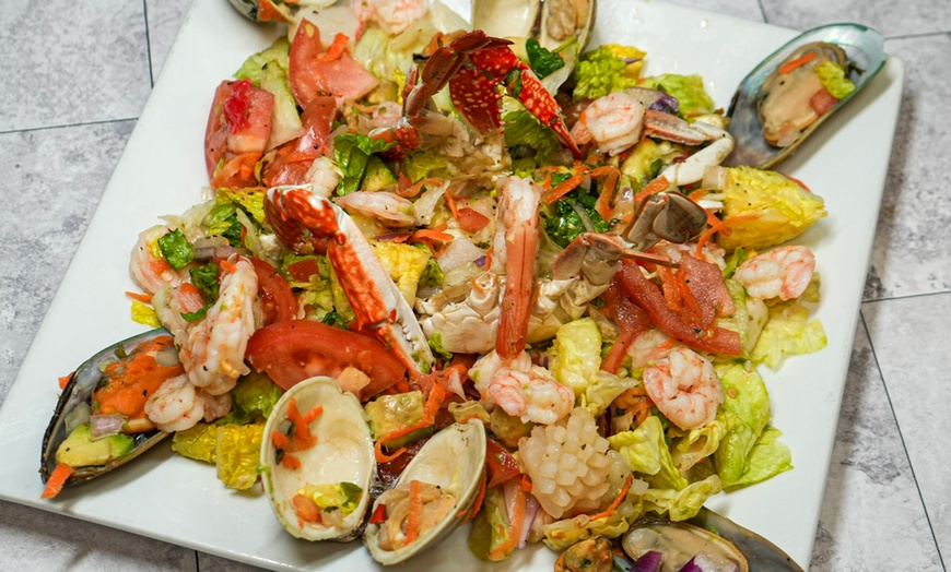 Image 10: Enjoy American-Colombian Dishes with Up to $150 Towards Food & Drinks