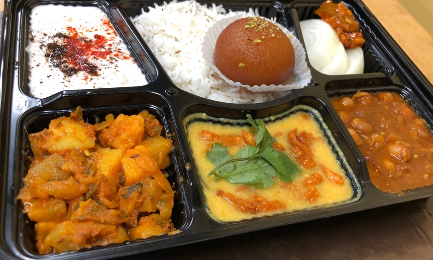 Image 1: Indian Vegetarian Thali for 2 / 4:(Rice, Rotis, 3 Curries & Dessert)