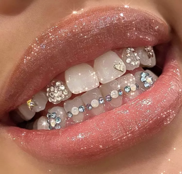 Experience safe and stylish tooth gems with The Flourished Company, offering options for one or two teeth, up to 60% off - Primary Image