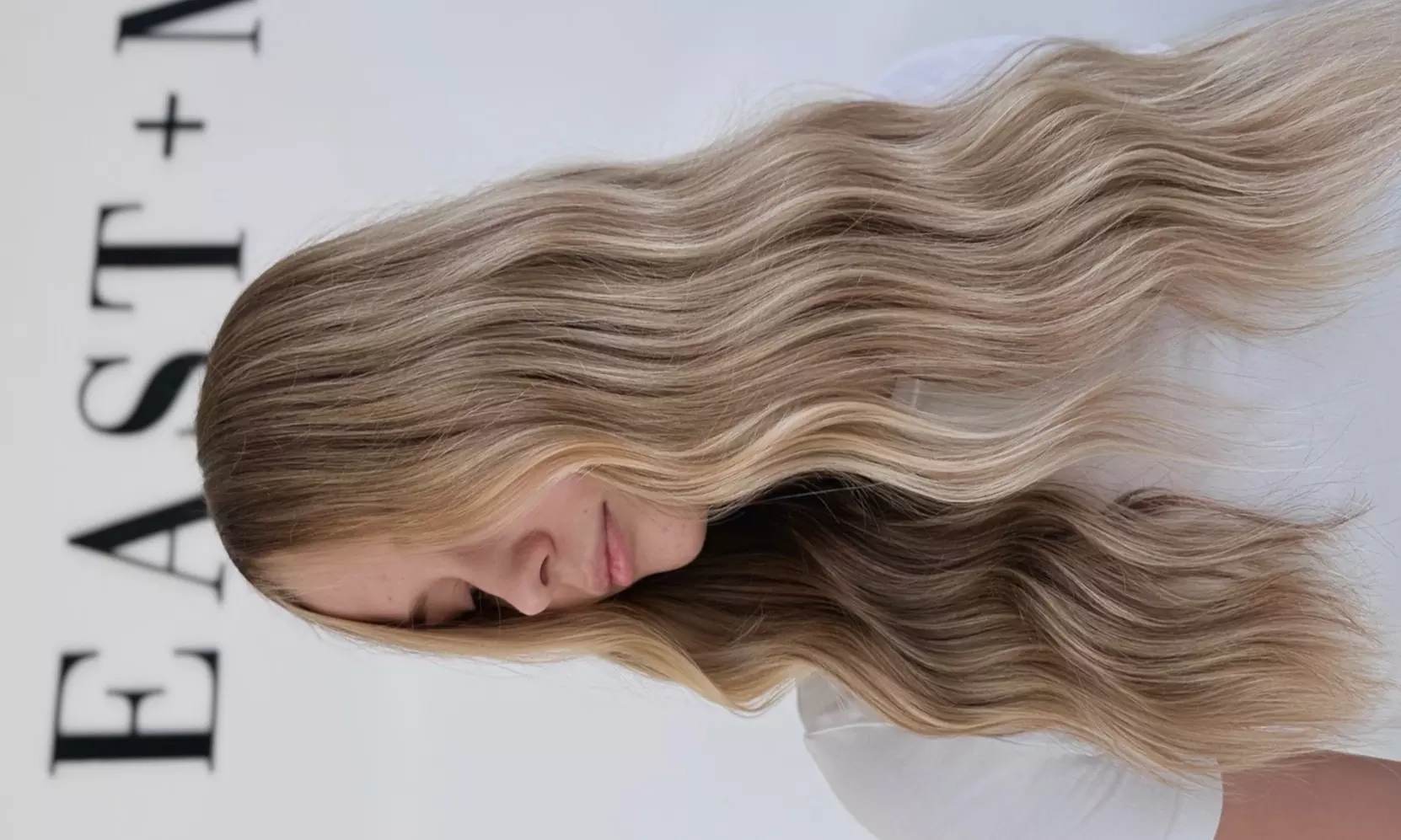 Transform Your Look with Full-Head Sew or Tape-In Extensions at East + Mane Collective (Up to 45% Off) - Primary Image