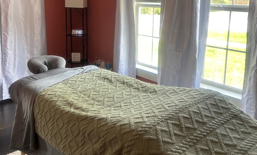 Image 4: 60-, or 90-min Massage with Hot Stones and Essential Oils