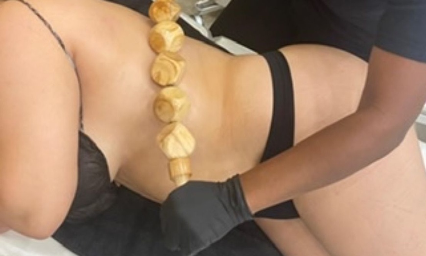 Image 1: Relax with One 20 or 40-Minute Wood Therapy Massage 