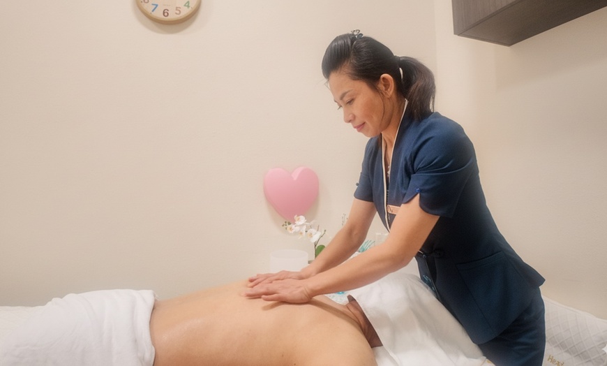 Image 1:  60 or 90-Minute Aromatherapy Massage & Hot Stone Relaxation Therapy 