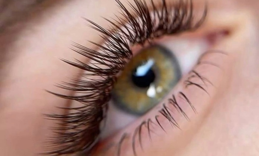 Image 1: Achieve a voluminous look with Enigma Salon And Spa's full set of eyelash extensions, up to 49% off