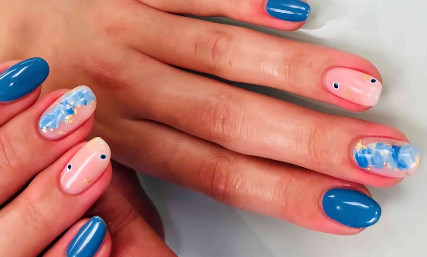 Image 5: Revitalize with Deluxe Manicure & Pedicure with Gel X Shellac at Miboso Massage (Up to 54% Off)