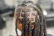 Revitalize with Retwist, Loc detox, Starter locs, and Free style at Melodic Roots & Wellness (Up to 48% Off) - Second Medium