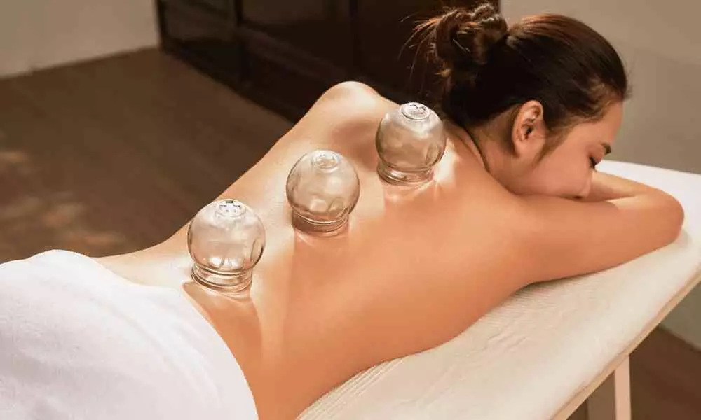 Unwind & Relax with 1, 2, or 3 30-Min Massage Sessions – Includes Free Cupping & Essential Oils  (Up to 55% Off) - Primary Image