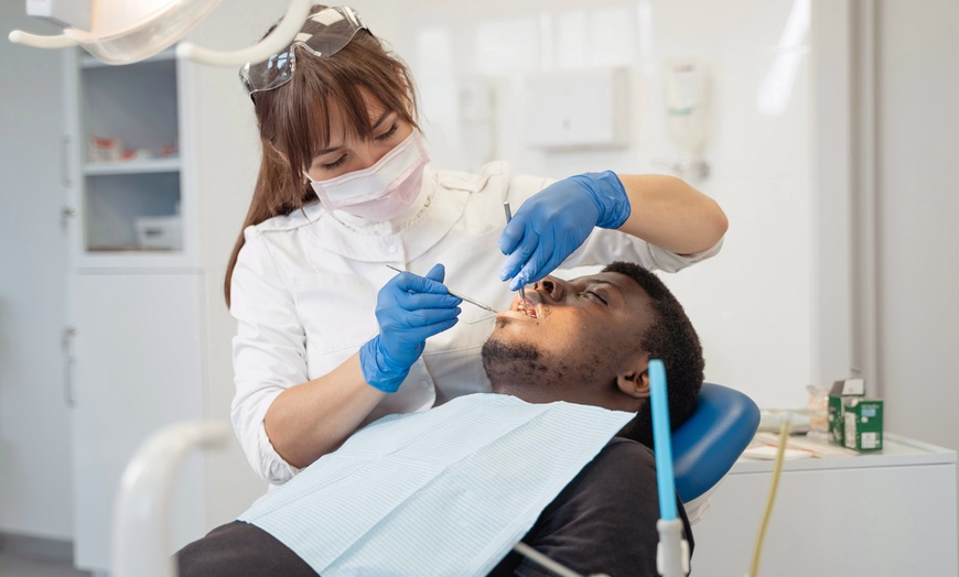 Image 1: Up to 34% Off on Dental Exam, Scale & Polish at Crown Dental