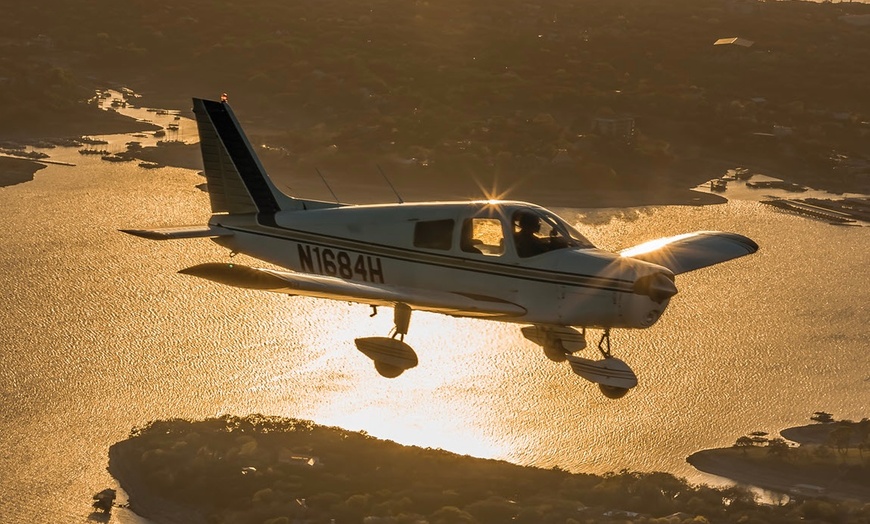 Image 2: One Romantic Sunset Flight or Discovery Flight Class for One or Two 