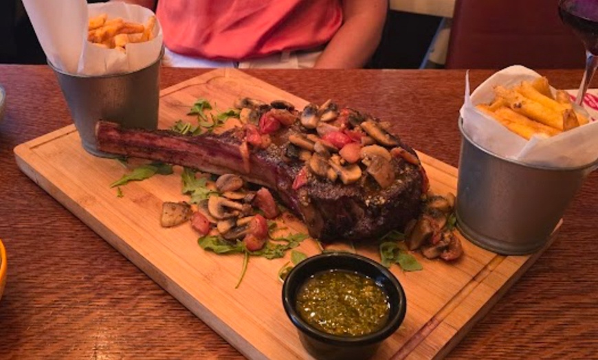 Image 1:  A 1.2KG Tomahawk Steak Meal for Two with Sides, Cocktails and More