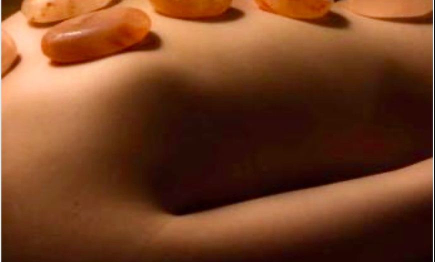 Image 1: Get a 50, or 80 Min Himalayan Salt stone massage w/without Back Scrub