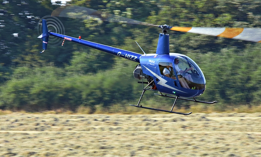 Image 1: Up to 39% Off on Helicopter Ride at Flying pig helicopters