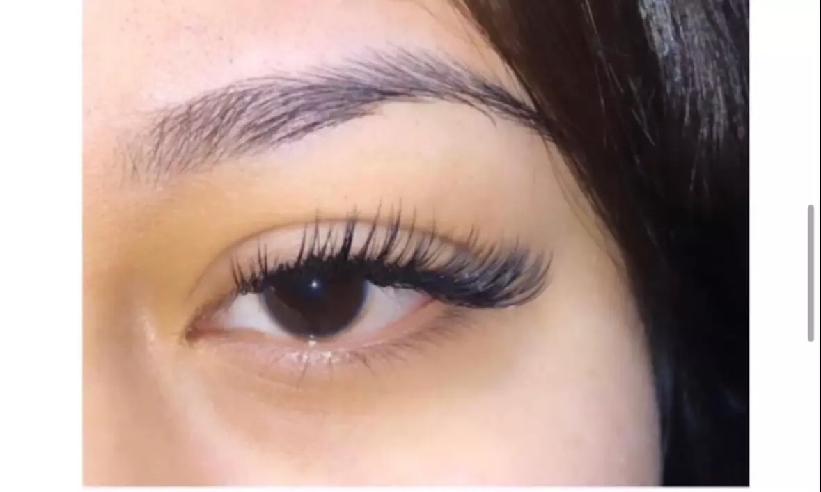 Full set of classic eyelash extensions for a natural look 