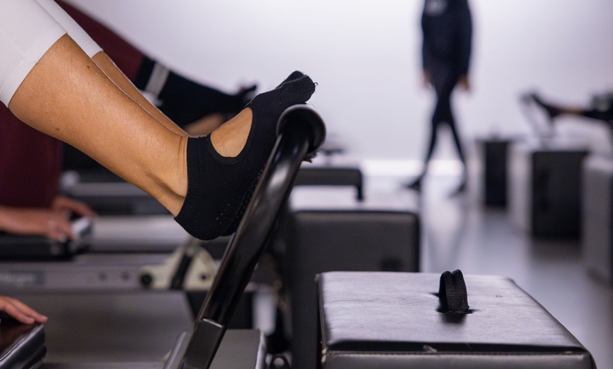 Image 1: Up to 61% Off on Experience Sensory Pilates' Reformer Classes
