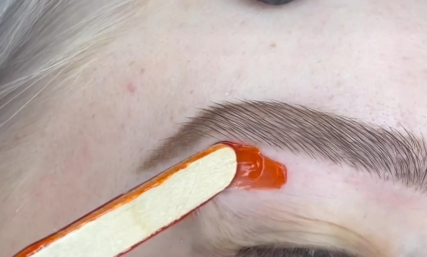 Image 4: Smooth Skin with One or Three Brazilian, or Eyebrow Waxing Sessions