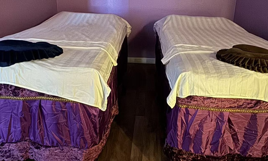 Image 1: Relax w/ a One 70-minute Deluxe Body Massage with Hot Stone Treatment