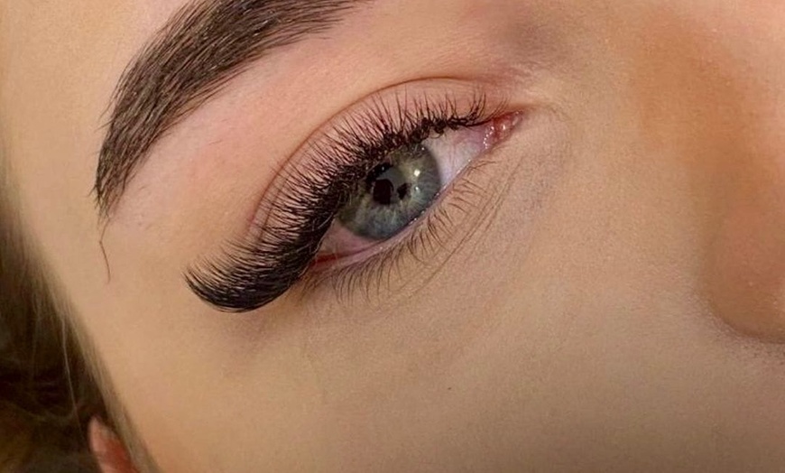 Image 2: Achieve a voluminous look with Enigma Salon And Spa's full set of eyelash extensions, up to 49% off