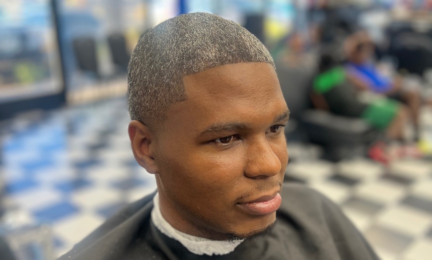 Image 3: Refined haircuts and traditional grooming services